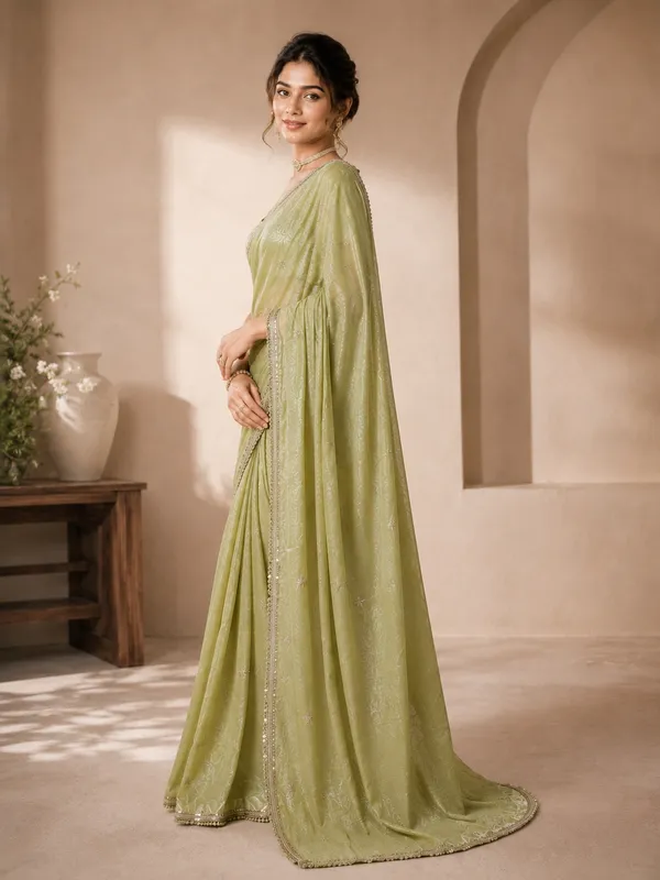 Elegant_Green_Designer_Saree_with_Delicate_Silver_Embellished_Border
