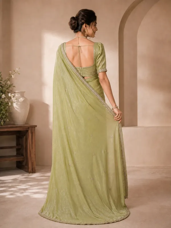Elegant_Green_Designer_Saree_with_Delicate_Silver_Embellished_Border