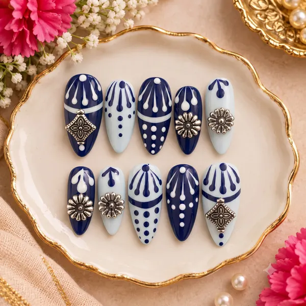 RAVUNE_Royal_Blue_Pottery_Press-On_Nails_Jewellery__–_Hand-Painted_Ceramic_Floral_Motifs,_Silver_Foil_&_Mirror_Charms
