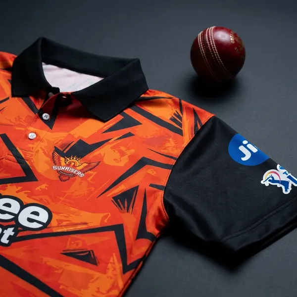 SRH_IPL_Cricket_Jersey_-_Orange_Geometric_Pattern_with_Shree_Cement_Sponsorship_3XL