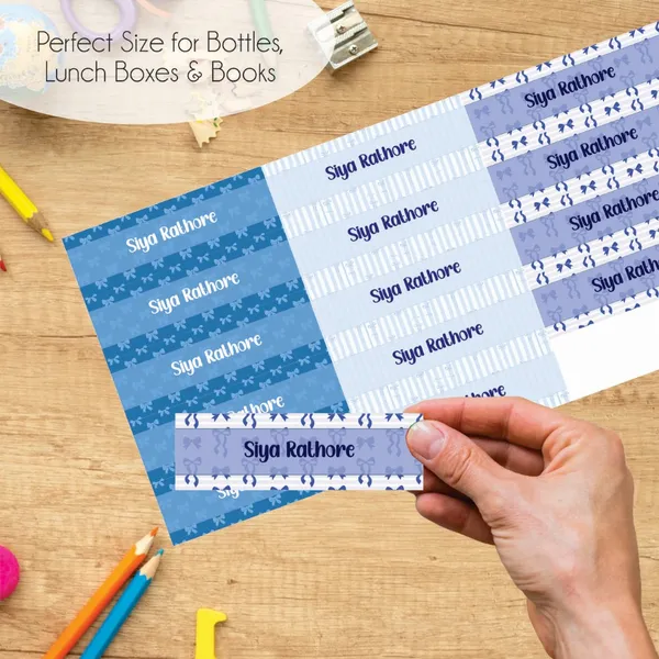 Zooplay_India_Waterproof_Name_Stickers,_Pack_of_90_Personalized_Stickers_for_School,_Bottles,_Lunchboxes_&_Stationery_�_Durable,_Peel_&_Stick,_Dishwasher_Safe_Tags_(Blue_Bow_Bliss)