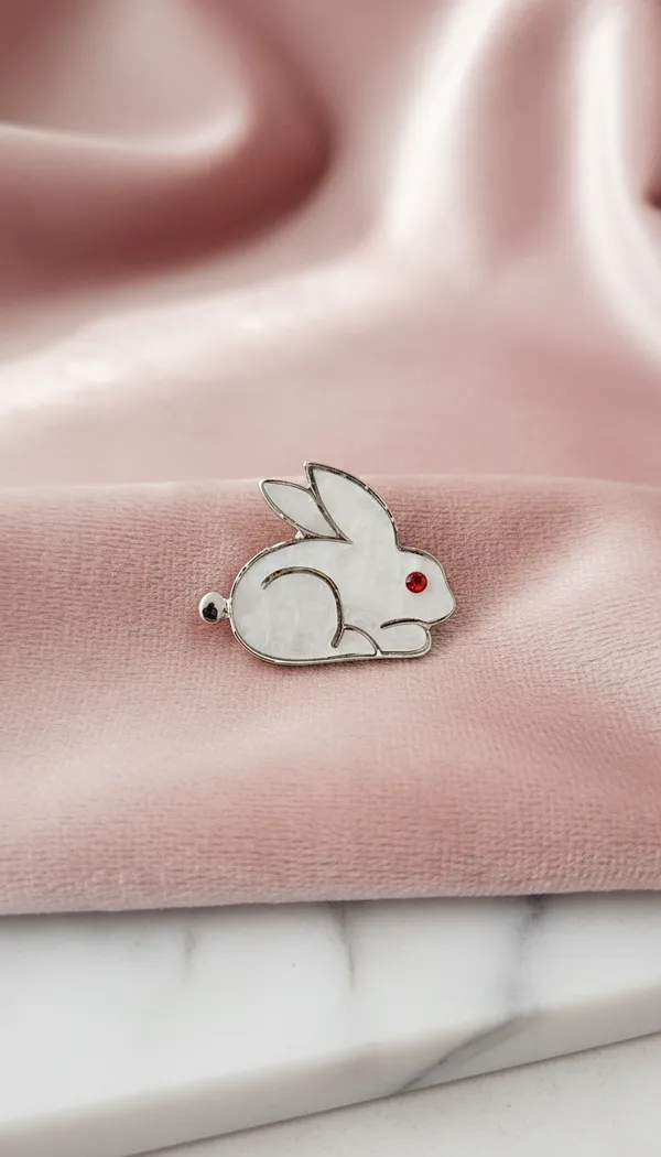 Sleek_White_Enamel_Rabbit_Pin_With_Ruby_Eye.