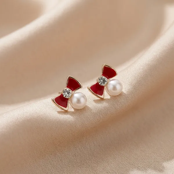 Enamelled_Bow_With_A_Diamond_Pearl_Mini_Studs
