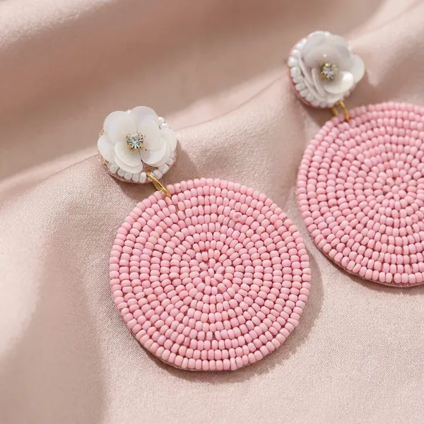 Beaded_Circle_Earrings_With_White_Flower_Accents