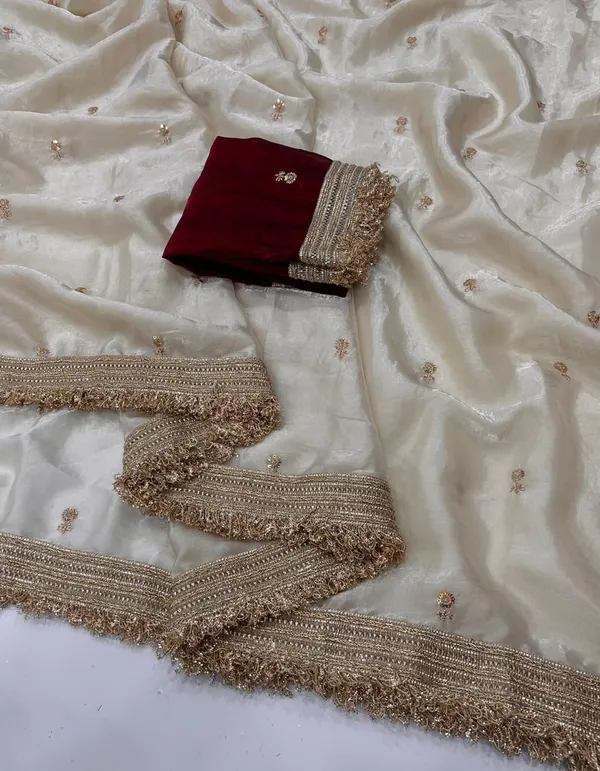 Elegant_Off_White_Saree_With_Gold_Embroidered_Border_And_Maroon_Blouse