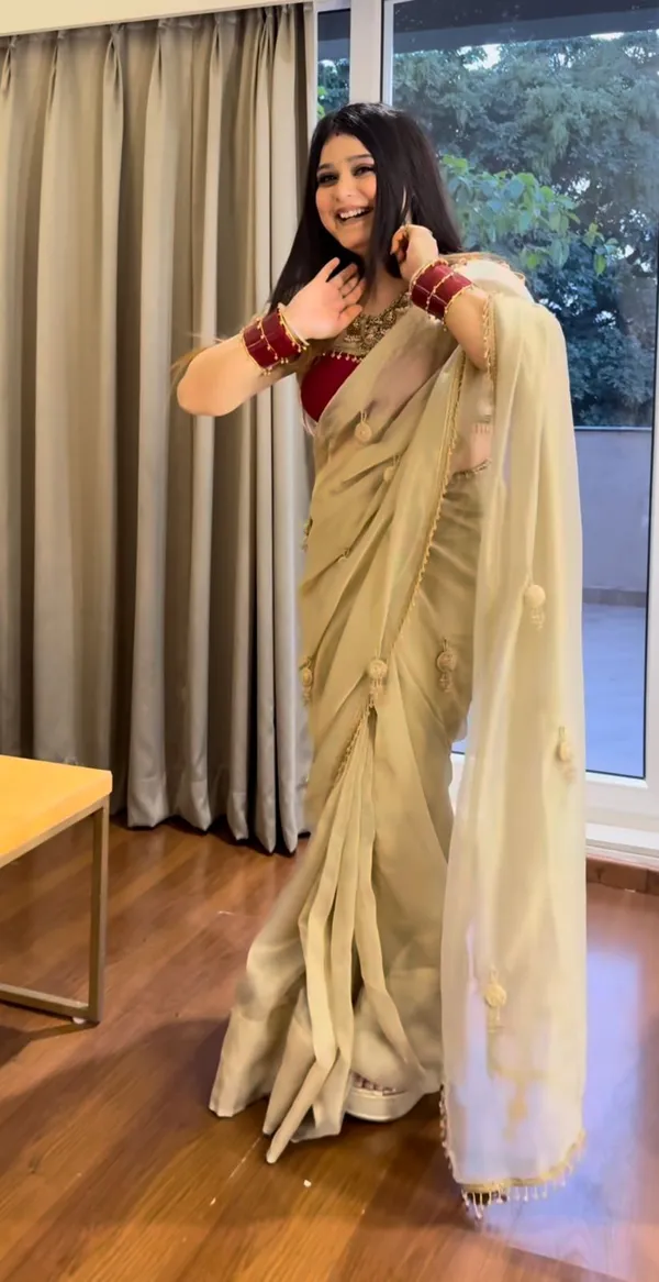 Beige_Stay_Beautiful_With_Our_New_Fandy_Sattin_Saree_With_Beautiful_Crystal_Moti_Lace_With_Beautiful_Handwork__Latkan_In_Pallu