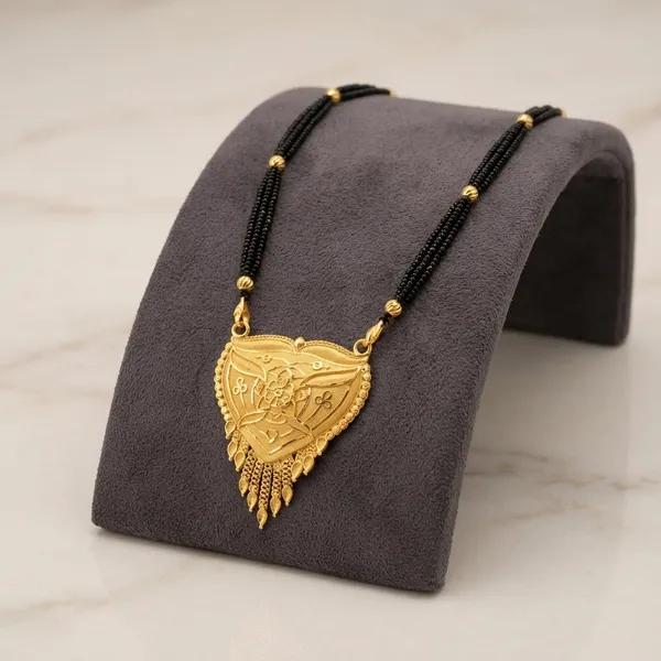 Triple_Black_Bead_Chain_With_Gold-Tone_Heart_Pendant_Mangalsutra_For_Women