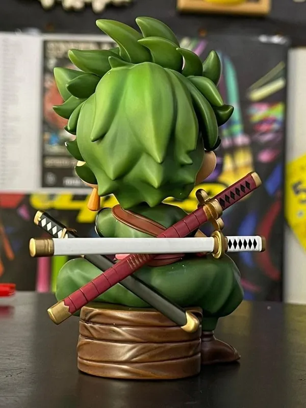Roronoa_Zoro_Kid_Sitting_Pose_Action_Figure_–_12.5_CM_|_One_Piece_Anime_Collectible