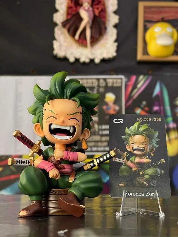 Roronoa_Zoro_Kid_Sitting_Pose_Action_Figure_–_12.5_CM_|_One_Piece_Anime_Collectible