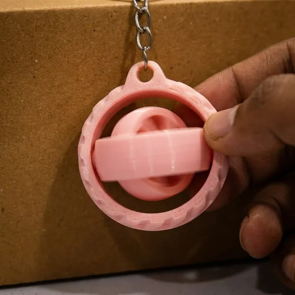 Light_Pink_Wheel_Design_Keychain_With_Hidden_Compartment