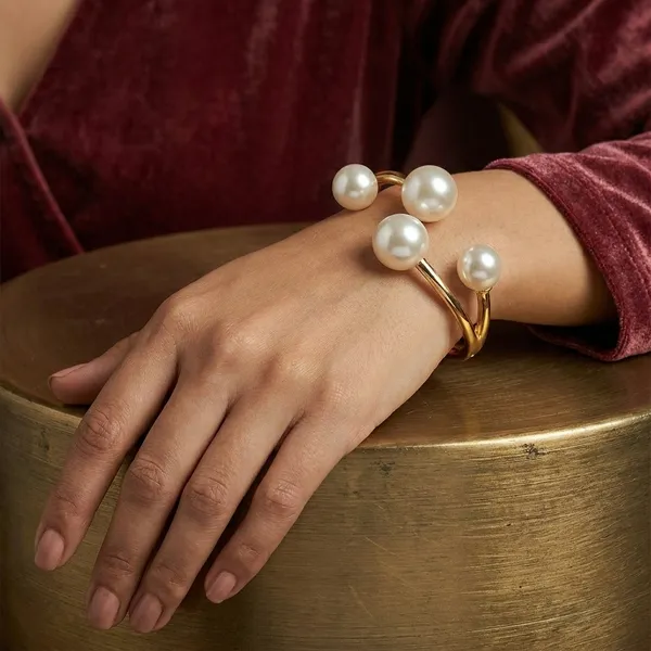 Gold-Tone_Pearl_Bangle_Bracelet_With_Four_Pearl_Accents