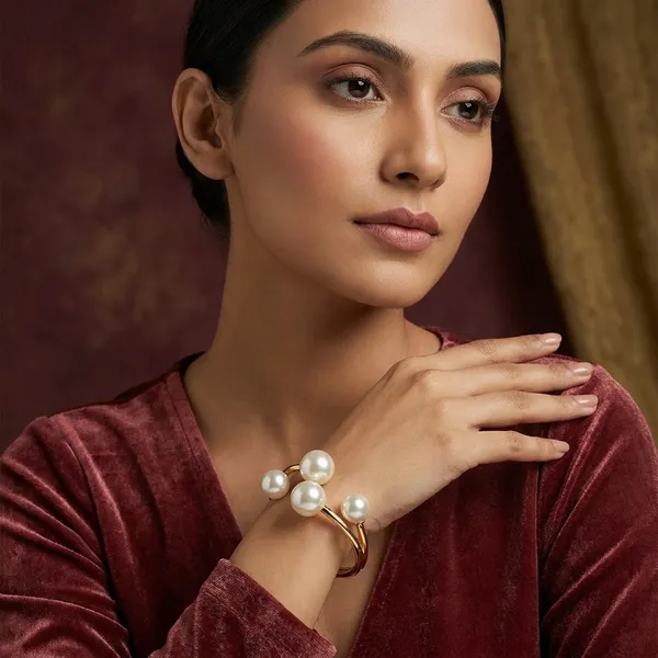 Gold-Tone_Pearl_Bangle_Bracelet_With_Four_Pearl_Accents
