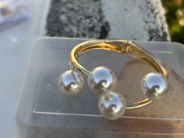 Gold-Tone_Pearl_Bangle_Bracelet_With_Four_Pearl_Accents