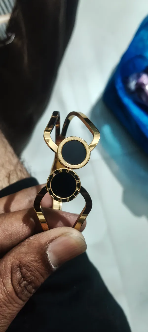 Double_Circle_Gold-Tone_Bracelet_With_Black_Enamel_Detailing