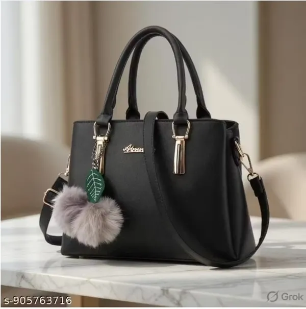 Stylish_Black_Handbag_With_Pom_Pom_Keychain_And_Leaf_Charm