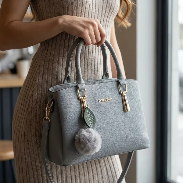 Grey_Faux_Leather_Handbag_With_Pom_Pom_Charm