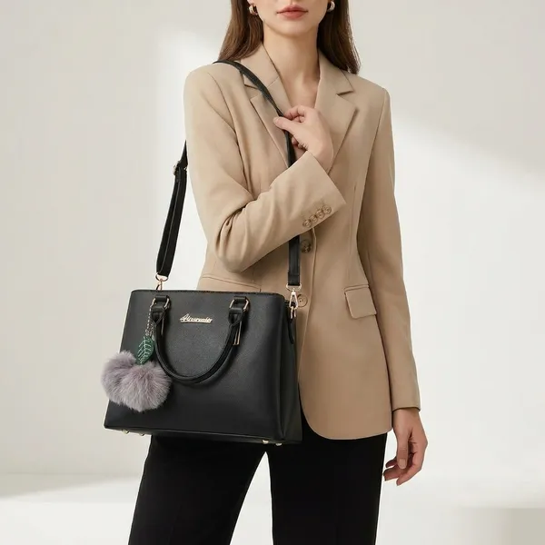Stylish_Black_Handbag_With_Pom_Pom_Keychain_And_Leaf_Charm