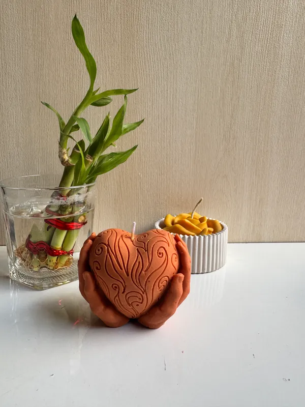 Orange_Heart_In_Hand_Candle