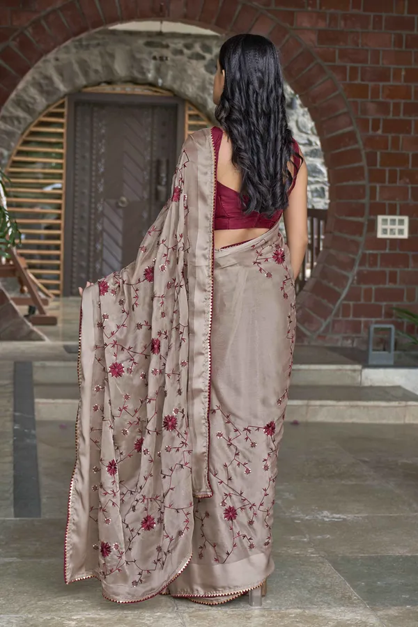 MANOHARI_Beige_Poly_Georgette_Sequence_And_Embroidery_Saree_With_Blouse_Piece