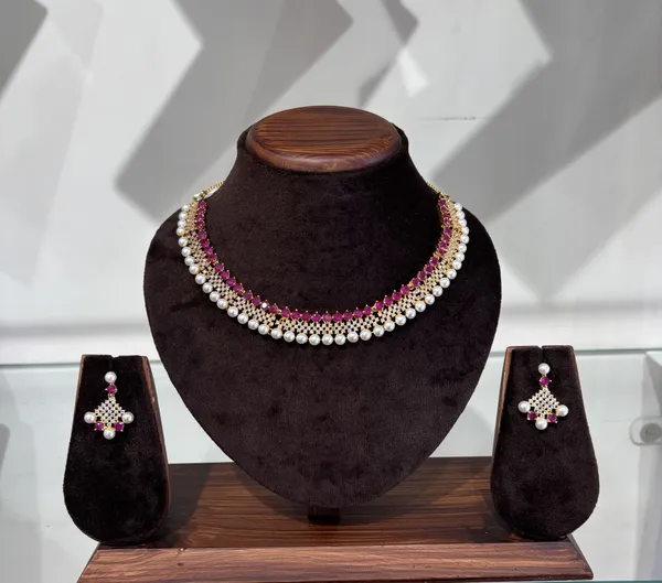 Elegant_Pearl_And_Ruby_Kundan_Necklace_Set_With_Matching_Earrings