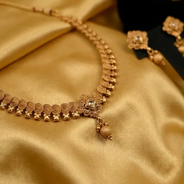 Traditional_Gold_Toned_Necklace_And_Earrings_Jewelry_Set_With_Crystal_Embellishments