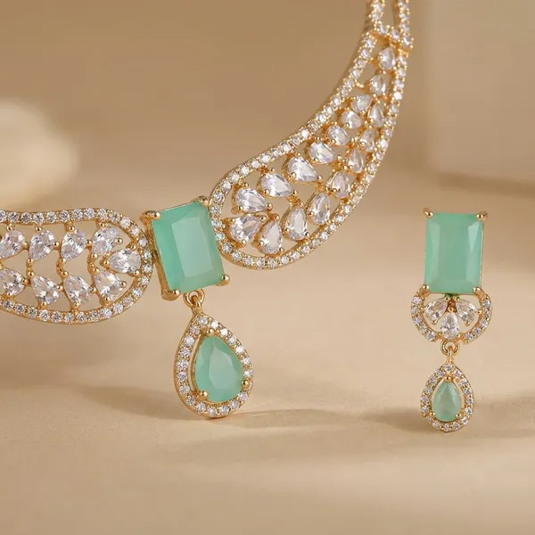 Elegant_Gold_Toned_Crescent_Moon_Necklace_With_Teal_Stone_Accent