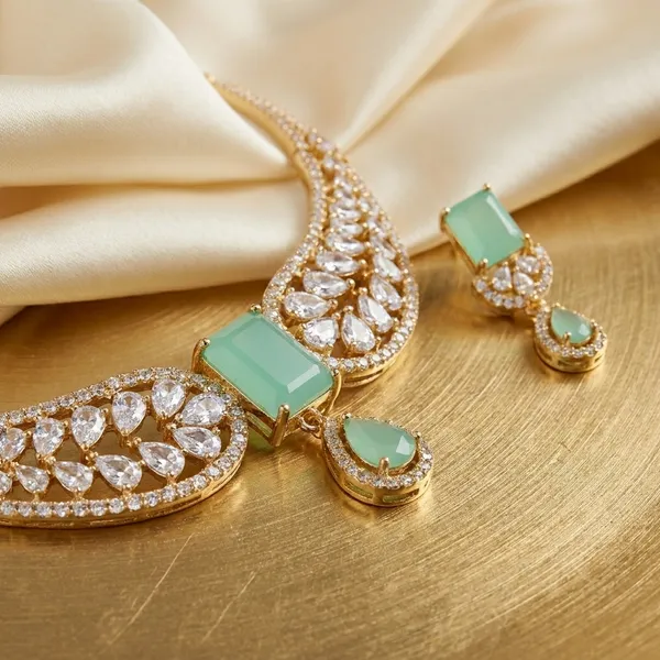 Elegant_Gold_Toned_Crescent_Moon_Necklace_With_Teal_Stone_Accent