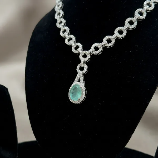 Elegant_Silver_Toned_Chain_Necklace_Set_With_Green_Stone_Pendant_And_Matching_Earrings