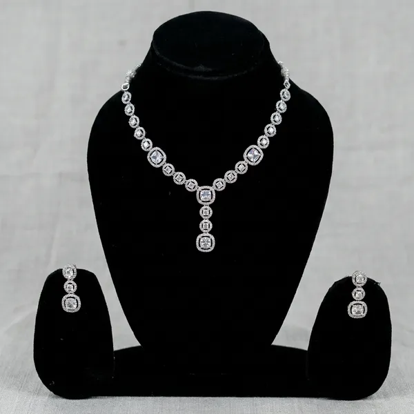 Three_Stone_Halo_Ring_With_White_Center_Stone
