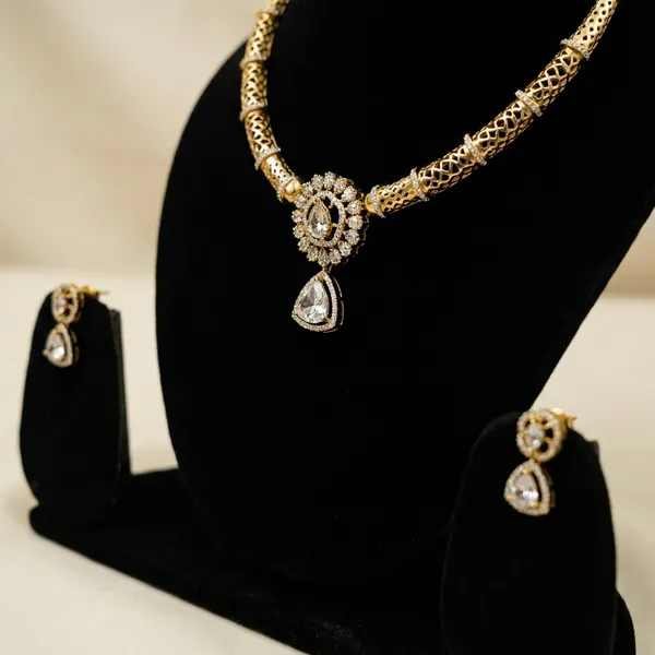 Traditional_Gold_Toned_American_Diamond_Necklace_Set_With_Pendant_And_Earrings