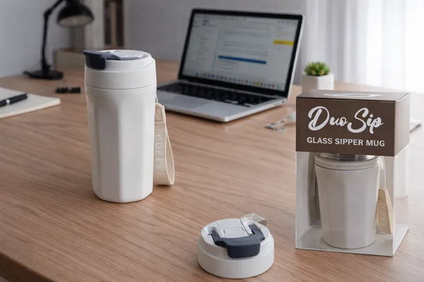 Duo_Sip_Glass_Sipper_Mug_With_Outer_Plastic_Body_Dual_Lid_Design_Travel_Mug