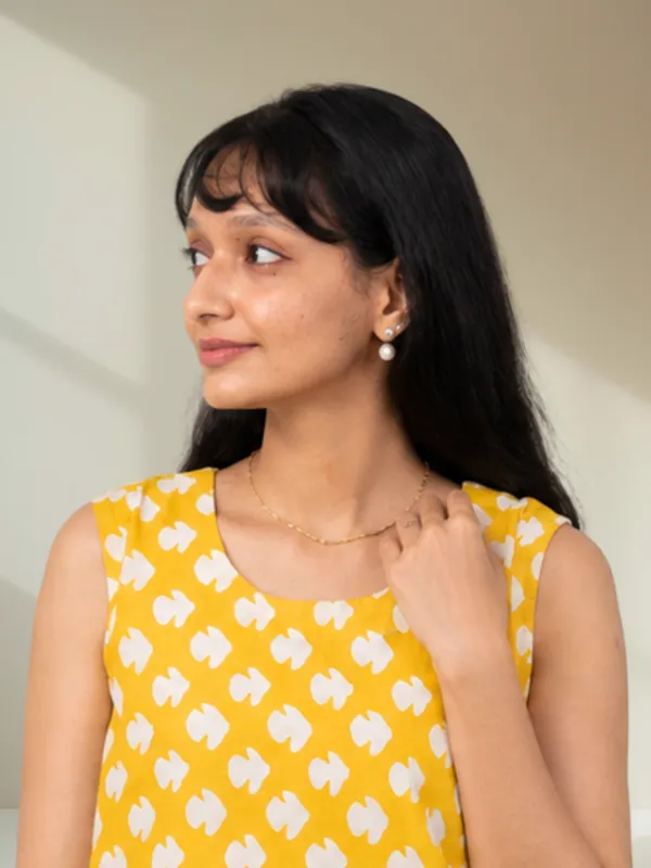 Yellow_Abstract_Petal_Motifs_Sleeveless_Cotton_Top_for_Women