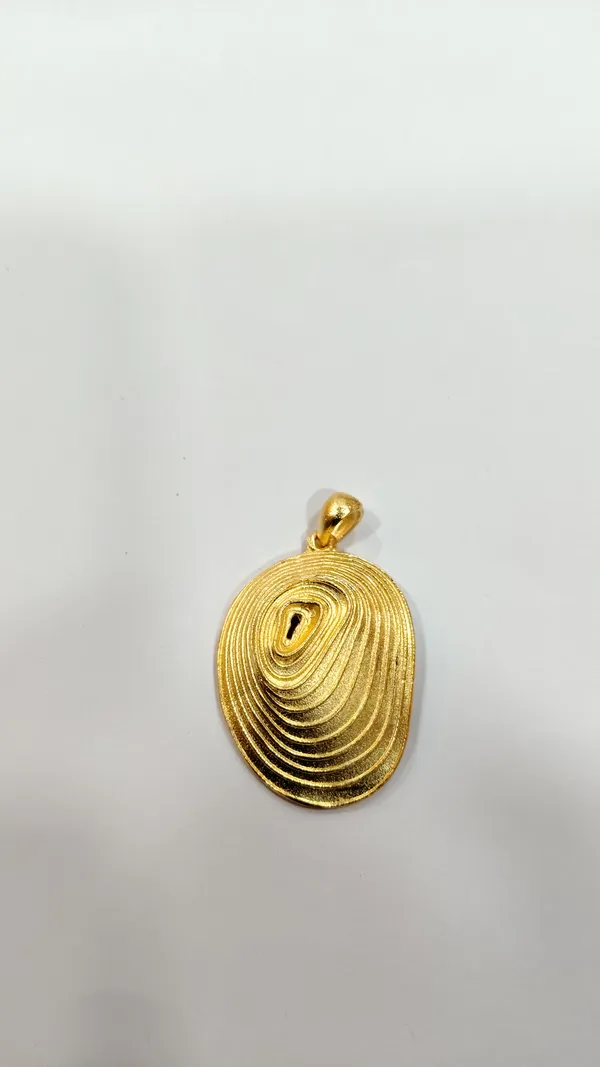 Gold-Toned_Oval_Pendant_With_Concentric_Spiral_Design