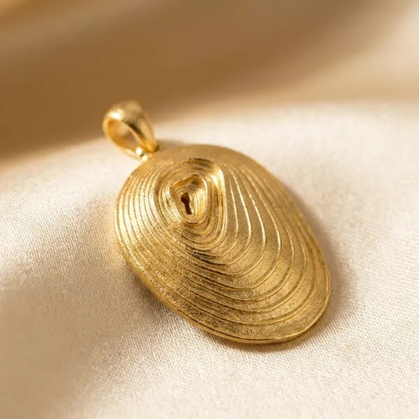 Gold-Toned_Oval_Pendant_With_Concentric_Spiral_Design