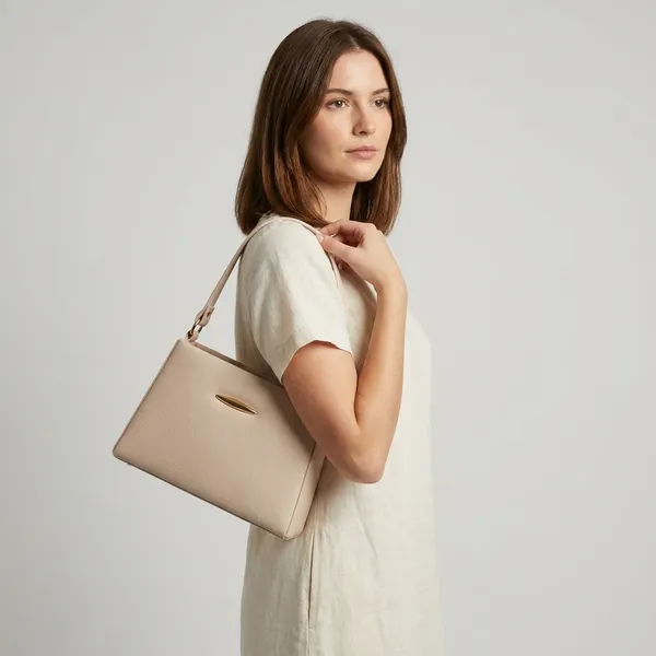 Elegant_Beige_Structured_Sling_Bag_With_Gold_Hardware