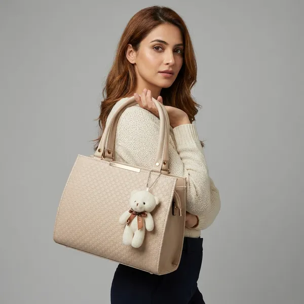 Elegant_Beige_Structured_Handbag_With_Detachable_Shoulder_Strap_And_Teddy_Bear_Charm