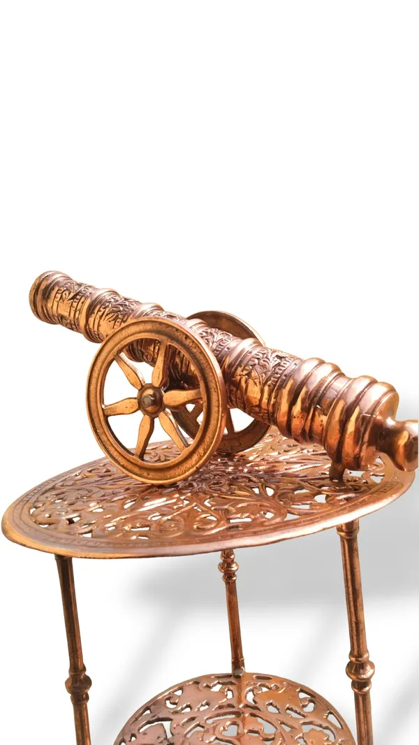 THE_EXQUISITE_ANTIQUE-STYLE_COPPER_FINISHED_METAL_SIDE_TABLE_PAIRED_WITH_A_DETAILED_CANNON_SCULPTURE.