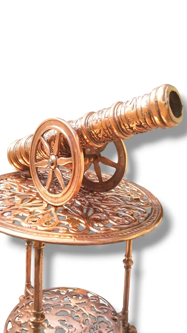 THE_EXQUISITE_ANTIQUE-STYLE_COPPER_FINISHED_METAL_SIDE_TABLE_PAIRED_WITH_A_DETAILED_CANNON_SCULPTURE.