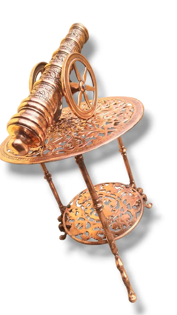 THE_EXQUISITE_ANTIQUE-STYLE_COPPER_FINISHED_METAL_SIDE_TABLE_PAIRED_WITH_A_DETAILED_CANNON_SCULPTURE.