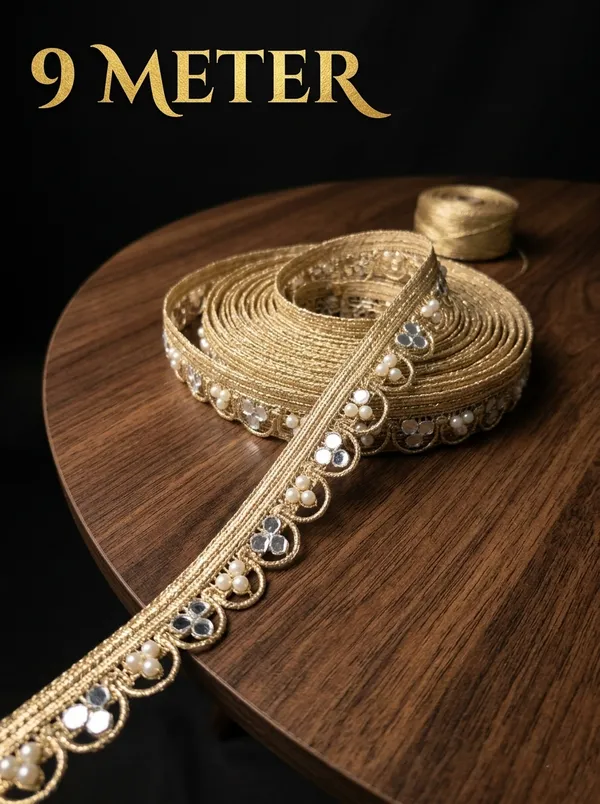 Dazzle_in_9_meters_of_pure_elegance_with_this_stunning_gold_lace_border,_intricately_woven_with_shimmering_mirror_work_and_delicate_pearls._Designed_to_transform_sarees,_lehengas,_and_kurtis,_this_luxurious_trim_adds_a_radiant,_festive_sparkle_to_your_ethnic_creations.