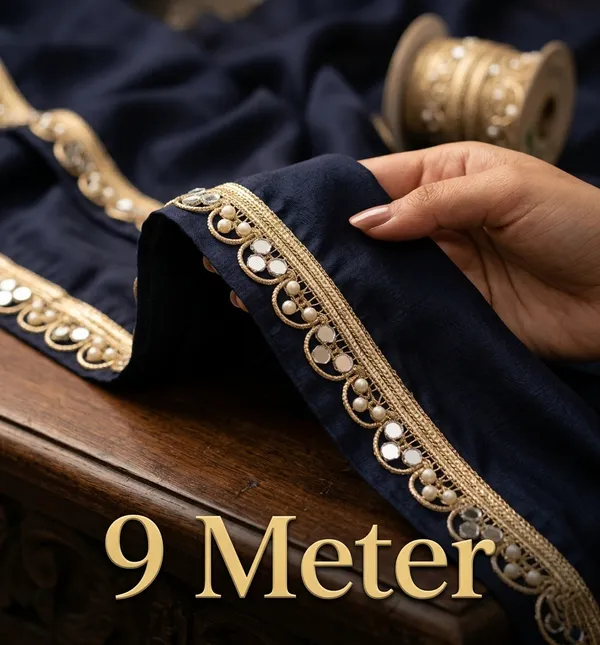 Dazzle_in_9_meters_of_pure_elegance_with_this_stunning_gold_lace_border,_intricately_woven_with_shimmering_mirror_work_and_delicate_pearls._Designed_to_transform_sarees,_lehengas,_and_kurtis,_this_luxurious_trim_adds_a_radiant,_festive_sparkle_to_your_ethnic_creations.