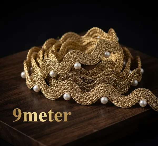Enhance_your_ethnic_fashion_line_and_bridal_collections_with_this_magnificentWavy_Gold_and_Pearl_Lace_Trim._Featuring_a_unique,_fluid_wave_design_woven_from_gleaming_metallic_gold_yarn_and_accented_with_smooth,_evenly_spaced_pearls,_this_designer_border_adds_dynamic_texture_and_graceful_elegance_to_any_garment.