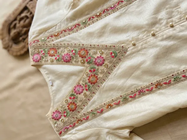 Exquisitely_crafted_net_neck_patch_and_border_set_featuring_vibrant_multi-colored_floral_embroidery,_delicate_threadwork,_and_shimmering_mirror_accents_on_a_sheer_beige_base._Perfect_for_adding_a_designer_touch_to_ethnic_blouses,_kurtis,_and_custom_garments.