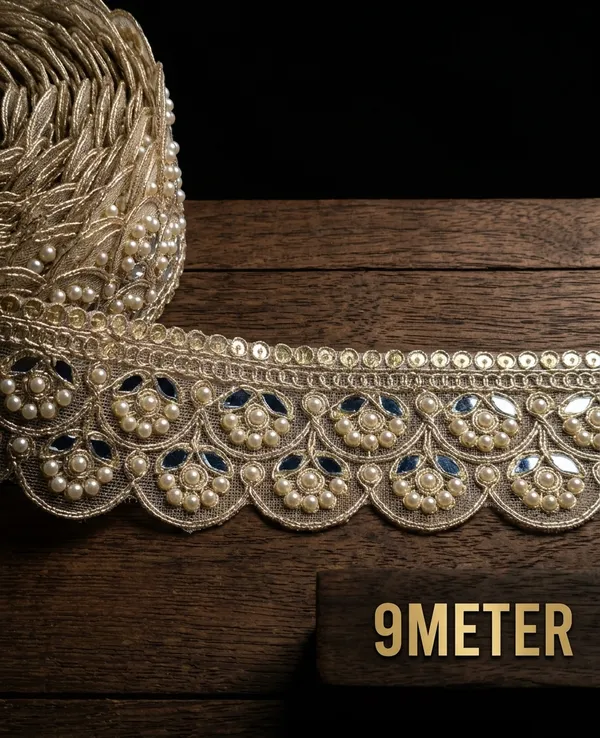 Infuse_your_ethnic_collections_with_royal_elegance_using_this_magnificent_Scalloped_Pearl_and_Mirror_Lace_Trim._Expertly_crafted_with_a_wide,_ornate_mesh_base_featuring_intricate_scalloped_arches_filled_with_floral-inspired_pearl_clusters_and_reflective_mirror_inserts,_this_designer_border_delivers_breathtaking_grandeur_to_high-end_apparel.