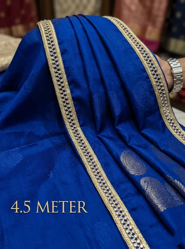 Transform_your_ethnic_wear_into_a_masterpiece_with_this_dazzling_Radhaji_Fancy_Lace_border._Spanning_4.5_meters,_this_exquisite_trim_features_an_intricate_diamond-patterned_mesh_embedded_with_brilliant,_sparkling_stones._Perfect_for_elevating_sarees,_lehengas,_and_designer_blouses,_it_adds_a_touch_of_glamour_and_timeless_sophistication_to_any_traditional_outfit.