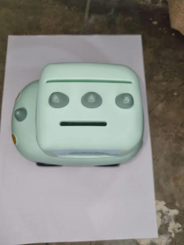Cute_Mint_Green_CarShaped_Bank_With_Dinosaur_Design
