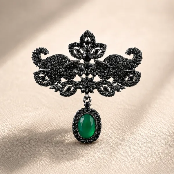 Elegant_Black_Crystal_Brooch_with_Green_Stone_Pendant