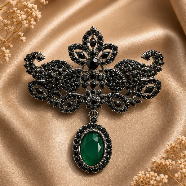 Elegant_Black_Crystal_Brooch_with_Green_Stone_Pendant