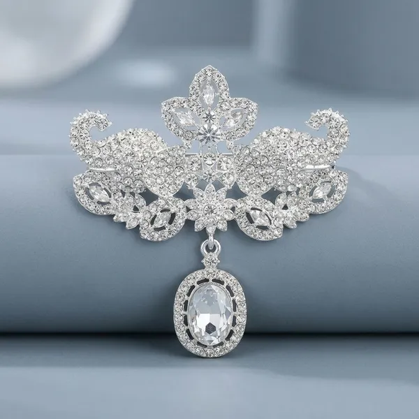 Ornate_Crystal_Brooch_with_Dangling_Oval_Pendant