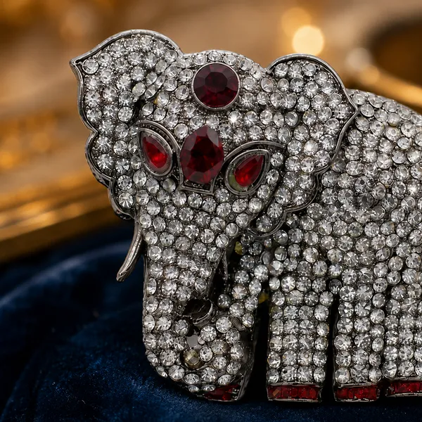 Sparkling_Crystal_Elephant_Brooch_-_Silver_Tone_with_Red_Accents